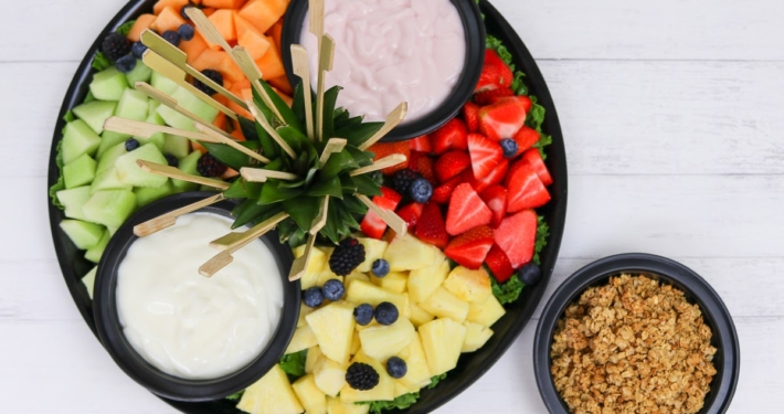 Fresh fruit served with honey-oat granola, and a variety of flavored yogurt. Perfect for a catered office breakfast meeting or event.